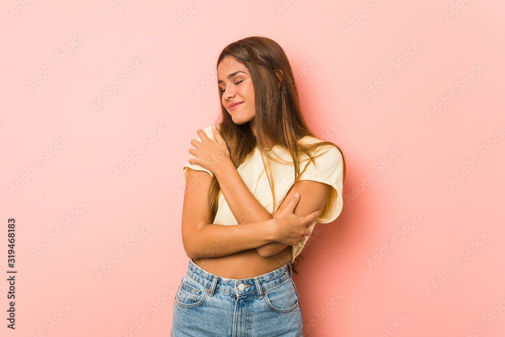 Young slim woman hugs, smiling carefree and happy. Young slim woman hugs, smiling carefree and happy.