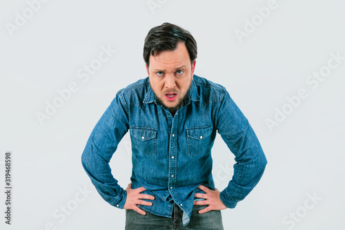 Tableau sur toile Young man with expression of tiredness and exhaustion