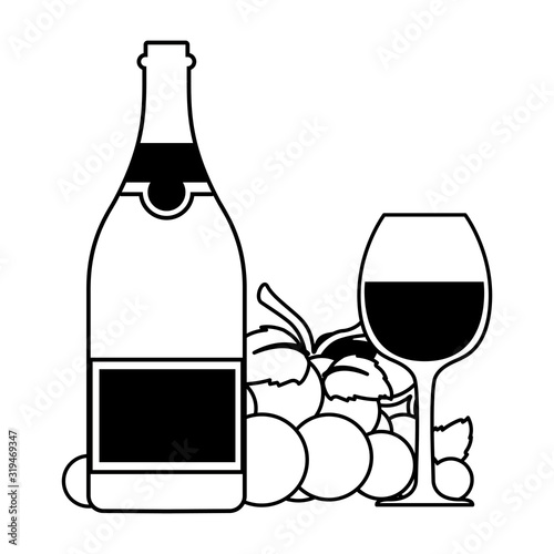 bottle and glass of wine with grapes