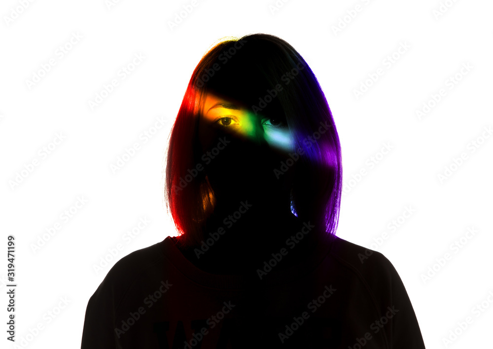 Live. Dramatic portrait of a girl in the dark on white studio background with rainbow colored line. Hidden things, human rights, equality, LGBT people's pride concept. Art elegance, creative.