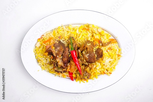 Mutton mandy rice and vegetables on plate isolated on white photo