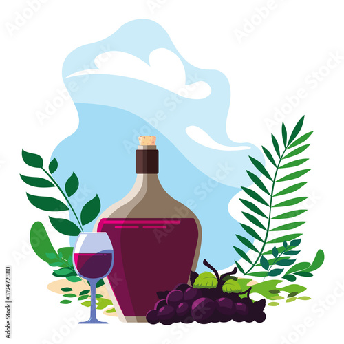 bottle and glass of wine with grapes