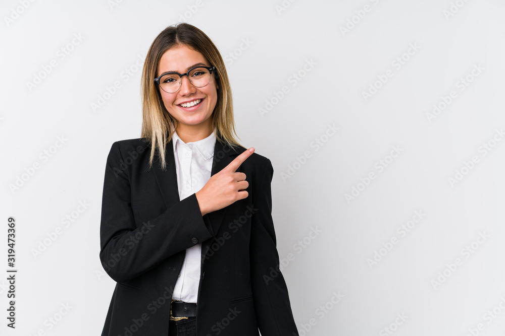 Young business caucasian woman smiling and pointing aside, showing something at blank space. - obrazy, fototapety, plakaty 
