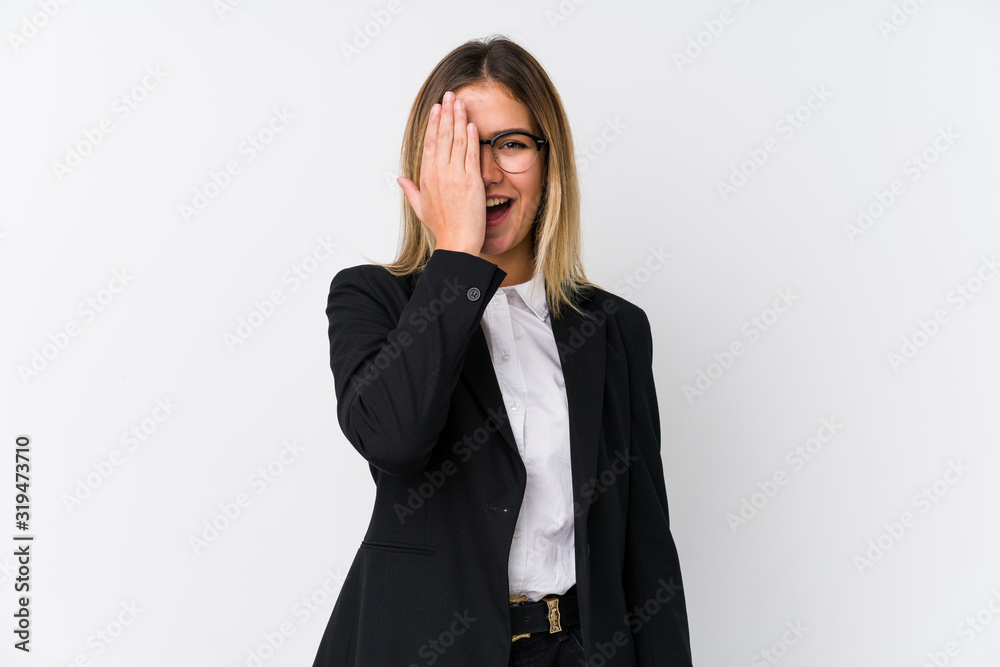 Young business caucasian woman having fun covering half of face with palm. Young business caucasian woman having fun covering half of face with palm.