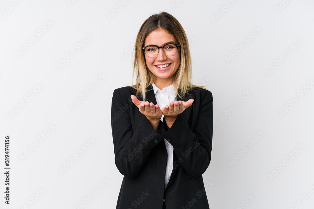 Young business caucasian woman holding something with palms, offering to camera. Young business caucasian woman holding something with palms, offering to camera.