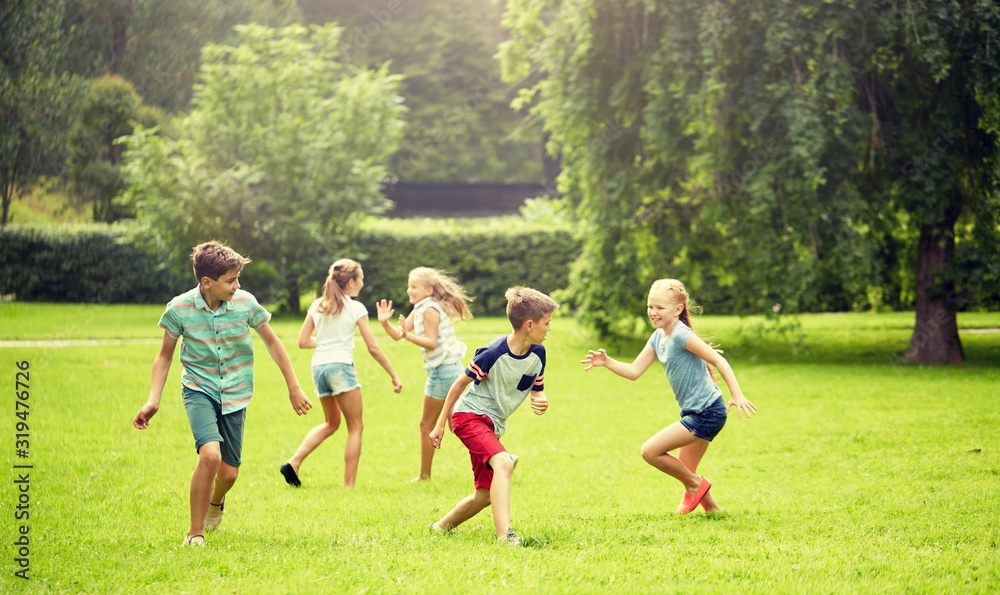 friendship, childhood, leisure and people concept group of happy kids