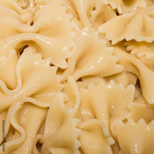 Cooked pasta in the shape of a butterfly.Background of pasta.