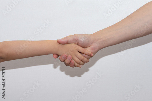  Handshake of a young man and an adult man