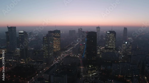Wallpaper Mural Aerial view of the cityscape with skyscrapers and infrastructure in the business center of Warsaw, at sunset at dusk. Poland. 05. February. 2020. Drone view of skyscrapers at dusk and city traffic. Torontodigital.ca