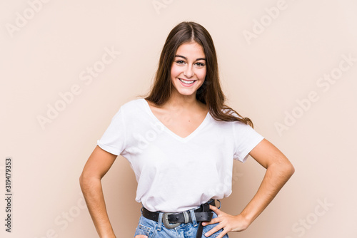 Bild auf Leinwand Young caucasian woman posing isolated confident keeping hands on hips