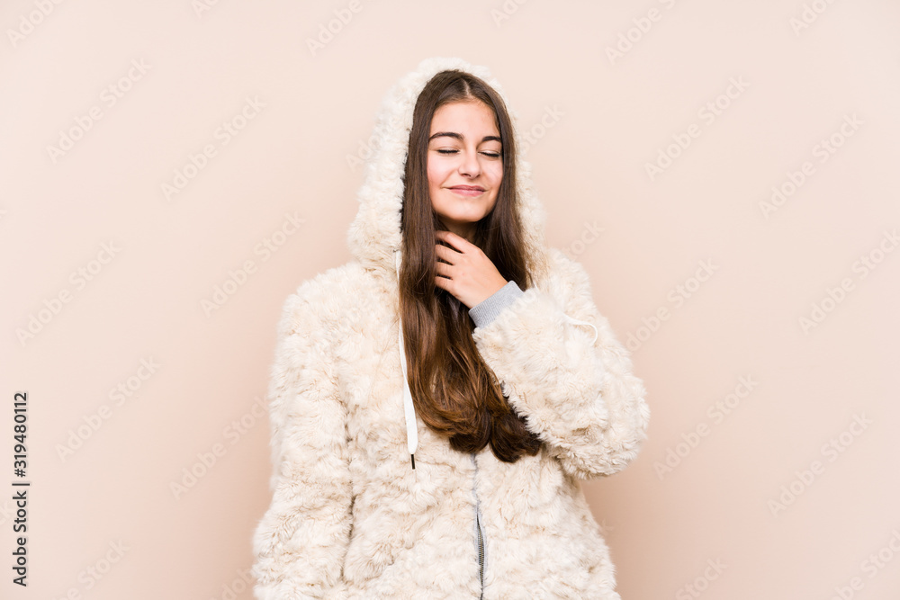 Young caucasian woman posing isolated suffers pain in throat due a virus or infection. Young caucasian woman posing isolated suffers pain in throat due a virus or infection.