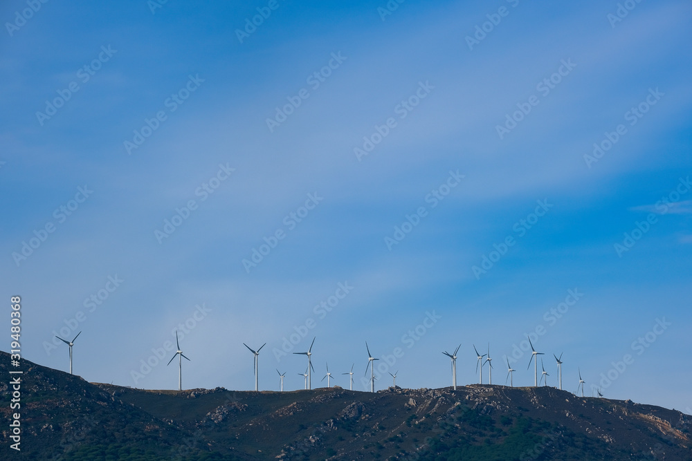 Wind turbines on a maountain top in Tarifa Spain Wind turbines on a maountain top in Tarifa Spain