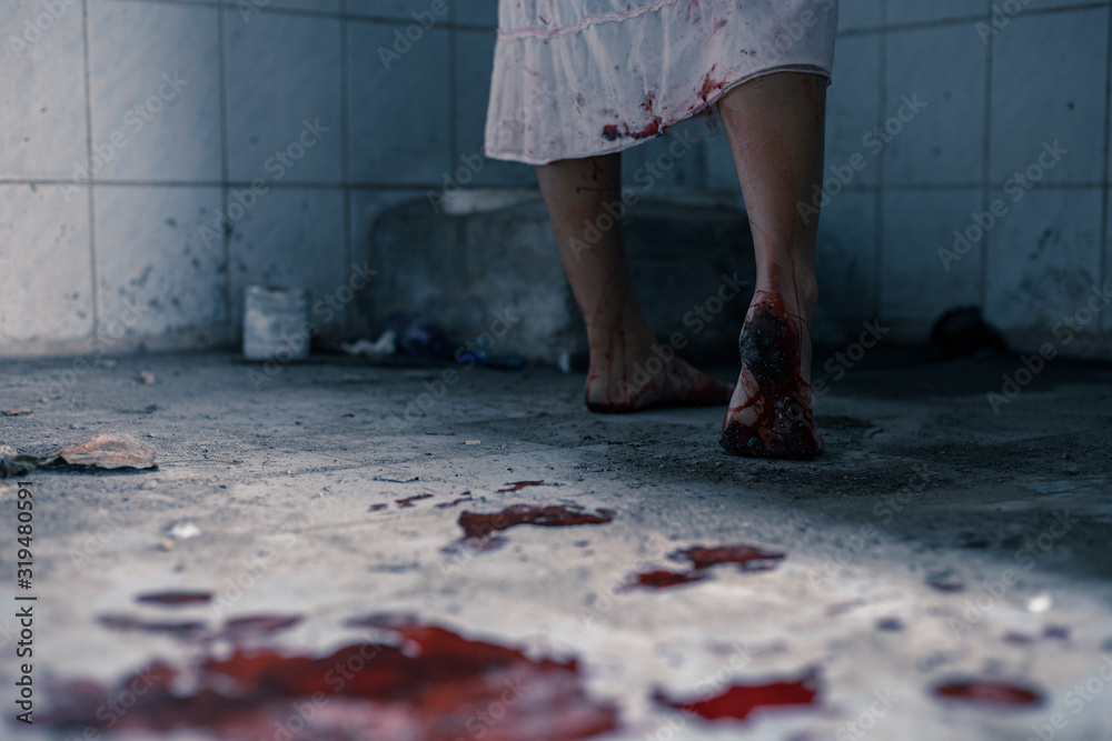 horror scence of leg woman with blood in toilet at abandoned house.Ghost women wear white dress stain blood. Halloween concept horror scence of leg woman with blood in toilet at abandoned house.Ghost women wear white dress stain blood. Halloween concept