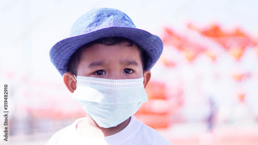 Pm2.5 and Coronavirus Air pollution concept. Little Asian or Chinese boy wearing mask for protect pm2.5 bad air. Wuhan coronavirus and epidemic virus from china. Pm2.5 and Coronavirus Air pollution concept. Little Asian or Chinese boy wearing mask for protect pm2.5 bad air. Wuhan coronavirus and epidemic virus from china.
