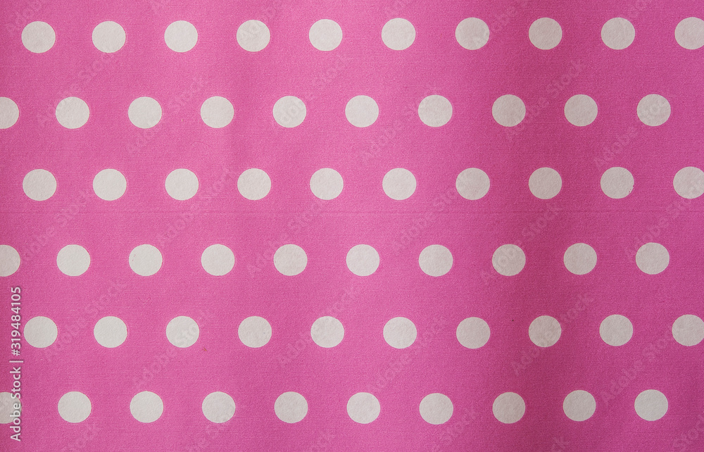 Pink polka dot fabric in full frame