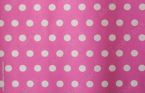 Pink polka dot fabric in full frame