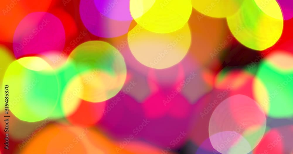 Magic Lights Create Romantic Bokeh. Multi-colored lights on a black background randomly move and flicker creating a pleasant festive background Magic Lights Create Romantic Bokeh. Multi-colored lights on a black background randomly move and flicker creating a pleasant festive background
