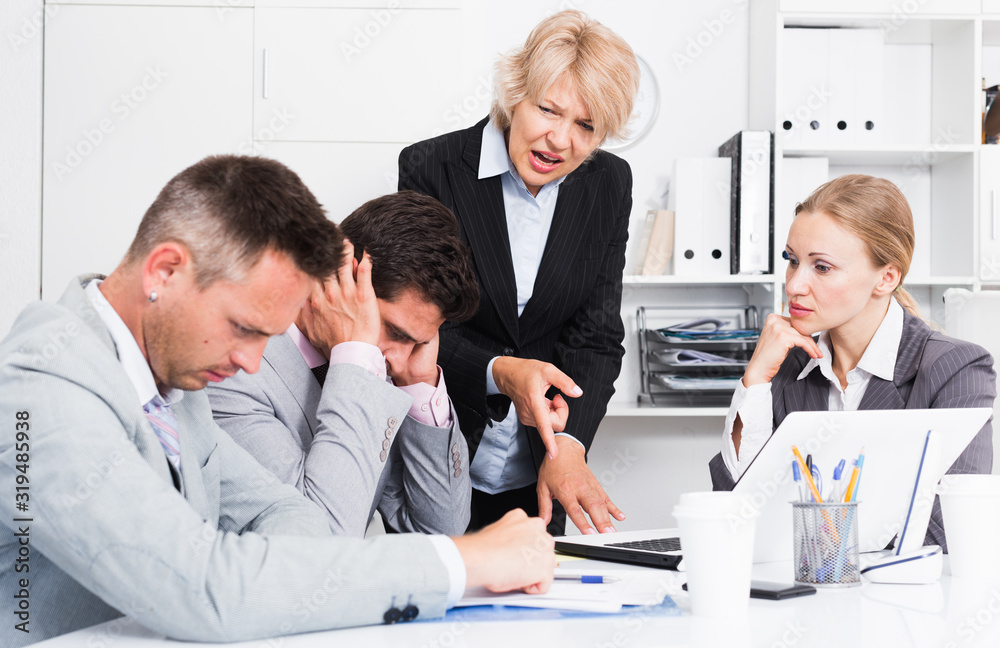 Fototapeta premium Female manager expressing dissatisfaction with teamwork