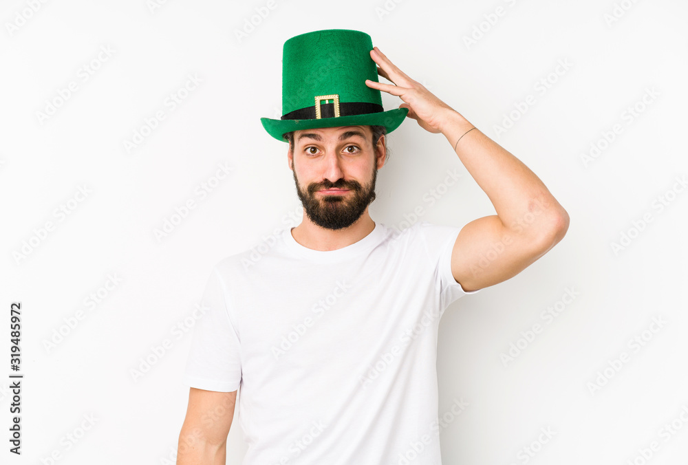 Young caucasian man wearing a saint patricks hat isolated being shocked, she has remembered important meeting. Young caucasian man wearing a saint patricks hat isolated being shocked, she has remembered important meeting.