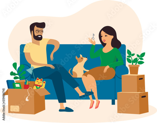 Young beautiful couple and their dog moving to new home