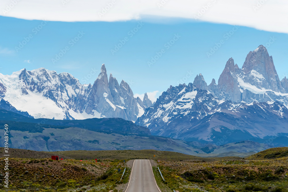Empty road with the Mount Fitz Roy on the background. Patagonia, Argentina