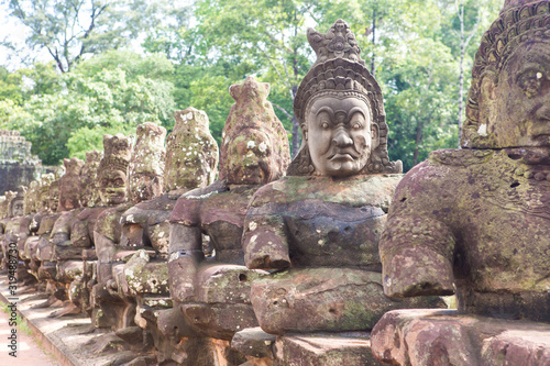 stone faces at Angkor Thom South Gate entrance  Cambodia