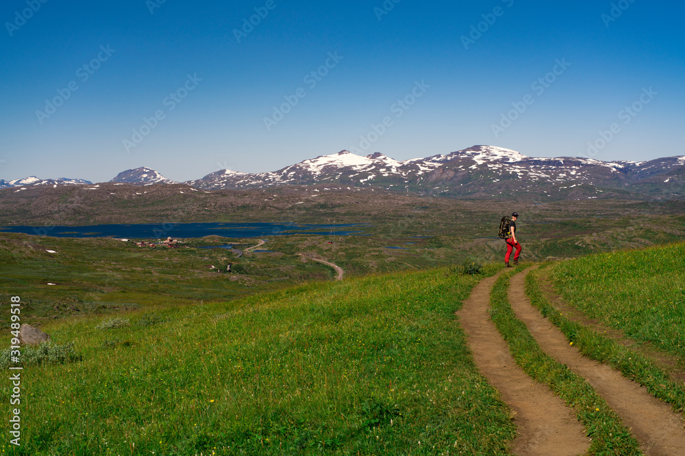 Big Hiking trail in Wide open Swedish High altitude Landscape in Northern Europe. Amazing and beautiful view of Tornetrask in Lapland near border to Norway. Trollsjon Hiking Trail.