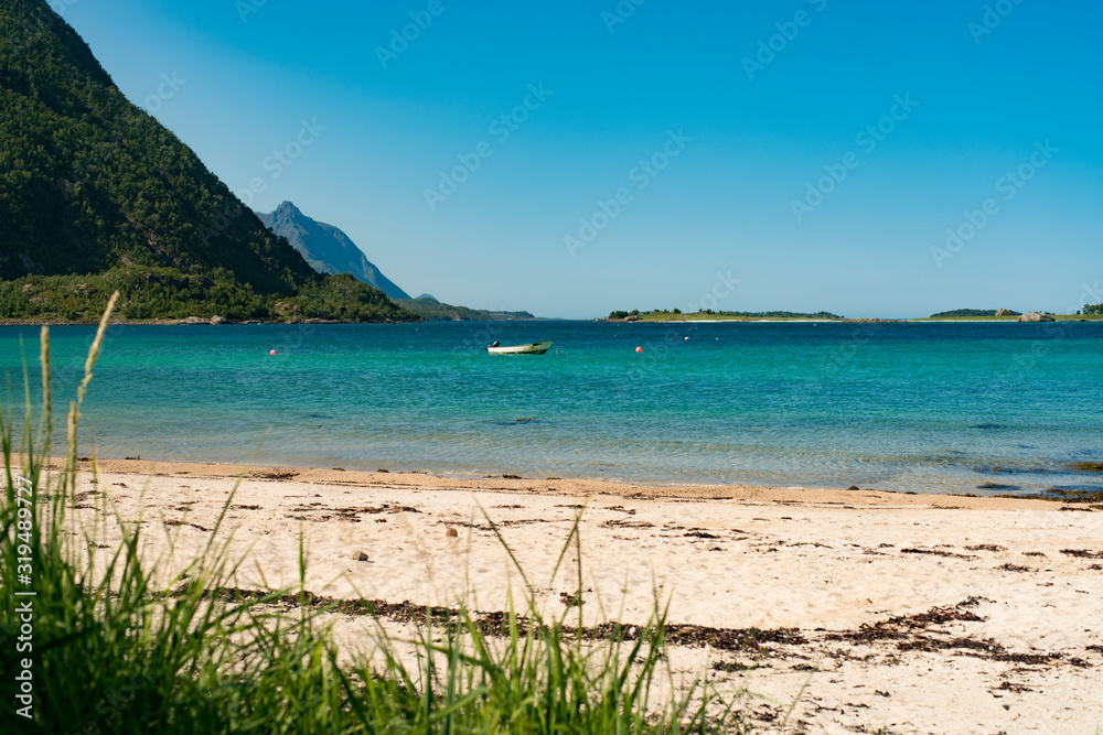 Dreamlike Beach during summer vacation on Hinnoya while traveling in Norwegian Landscape towards Lofoten island - Northern Norway scenery during summer. Dreamlike Beach during summer vacation on Hinnoya while traveling in Norwegian Landscape towards Lofoten island - Northern Norway scenery during summer.