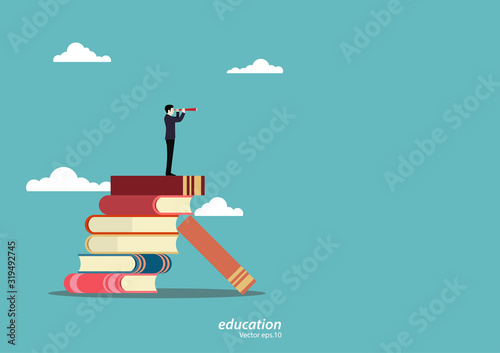 Businessman standing on book looking go to the future