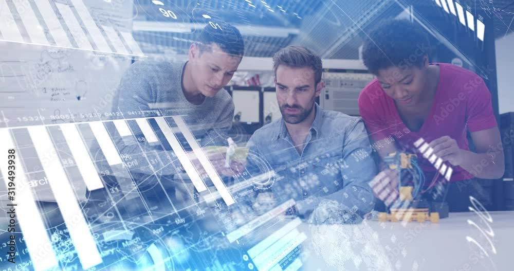 Digital composite of tech start up team working on robot with graphics moving over the screen