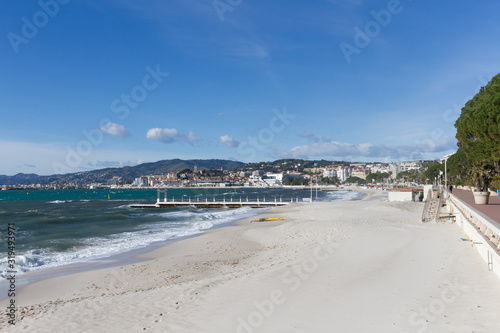 Cannes beach with view of Palais des Festivals and old town