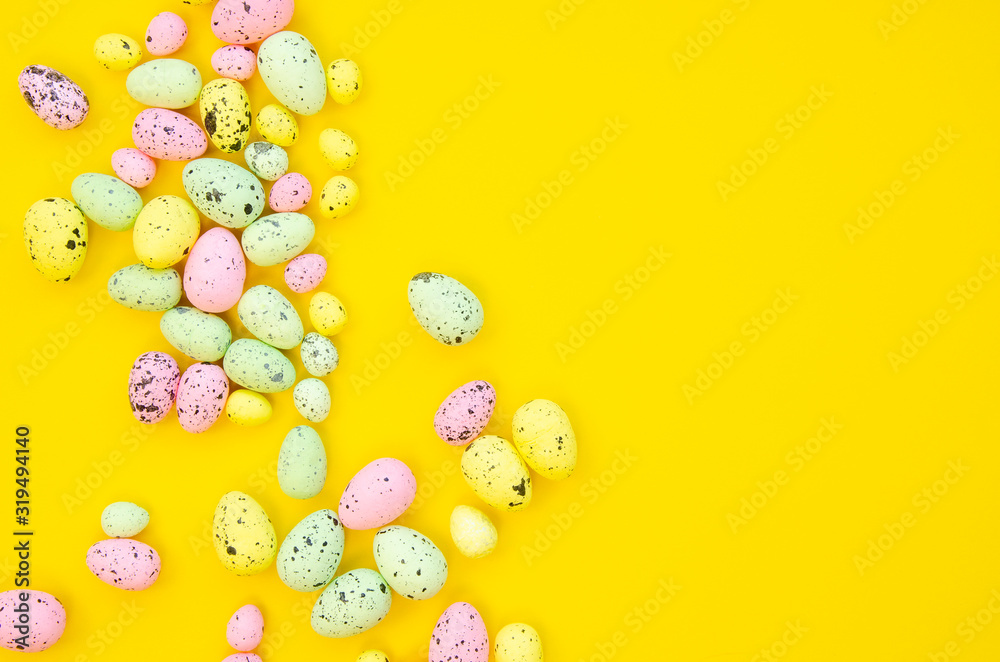 Quail Easter eggs frame isolated on yellow background. Copy space, top view Quail Easter eggs frame isolated on yellow background. Copy space, top view