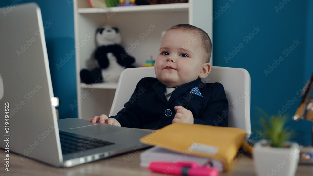 Boy little child businessman boss in office use laptop look at camera sitting play creative boy happy job kid work child computer education young suit cute career confident slow motion. Boy little child businessman boss in office use laptop look at camera sitting play creative boy happy job kid work child computer education young suit cute career confident slow motion.