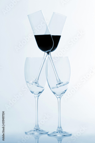 four glasses of wine on a light background