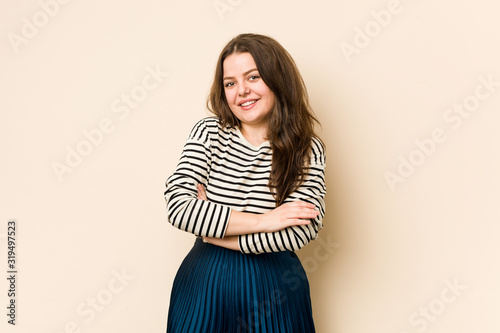 Fotografie Young curvy woman laughing and having fun.