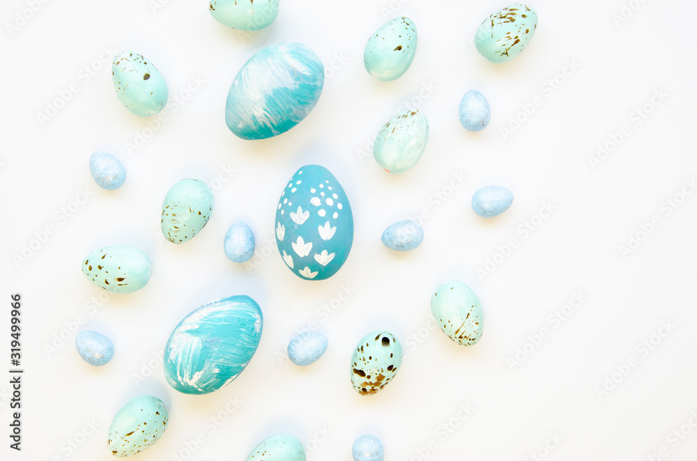 Set of blue festive Easter eggs on white background. Top view Easter concept
