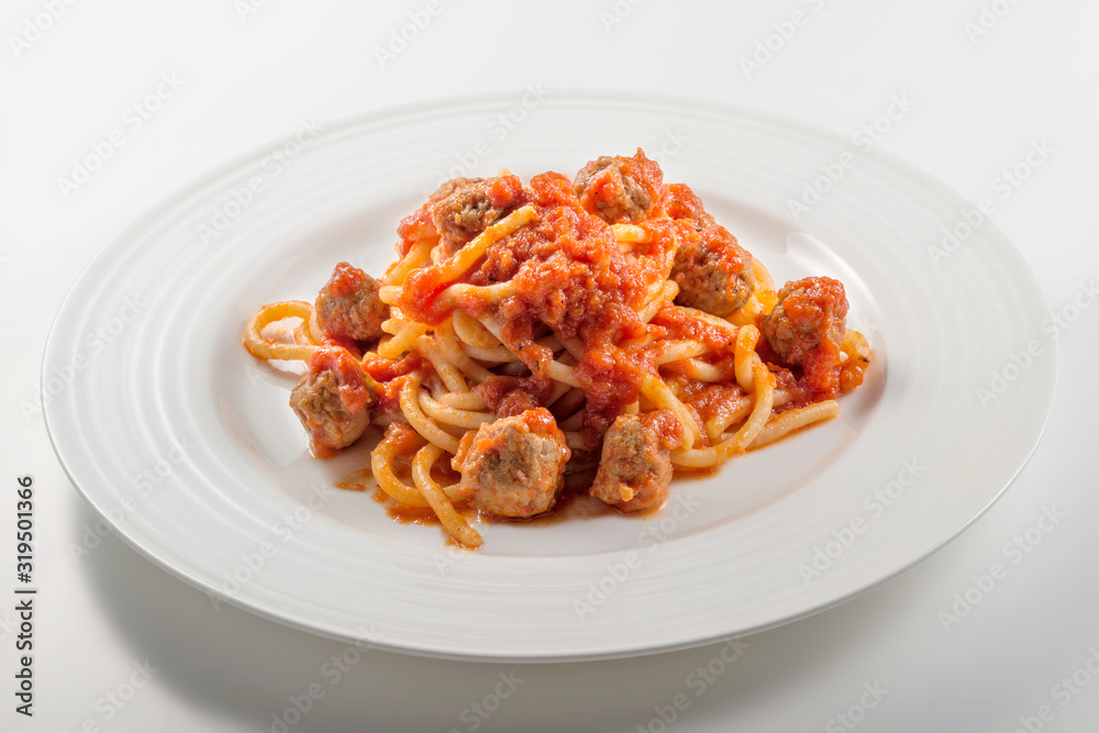 Plate of spaghetti with tomato and meatballs