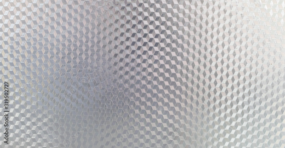 Fototapeta Reflective metal surface. Reflective gray metal with diamond shaped triangles