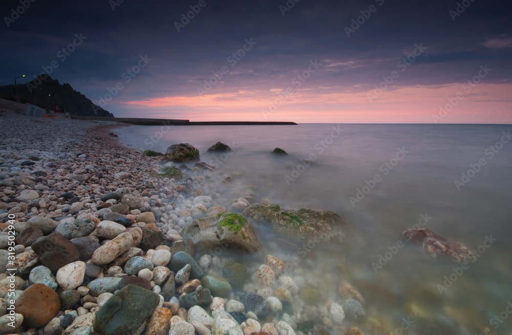 rocky seashore at sunrise