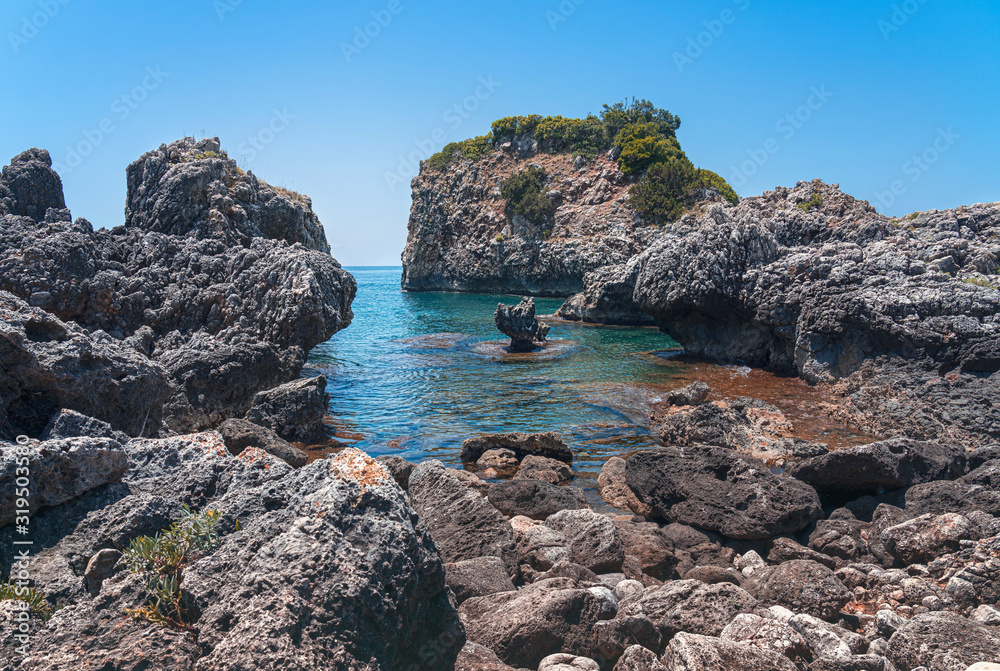 landscape with rocky coast near the city of ammoundia, greece
