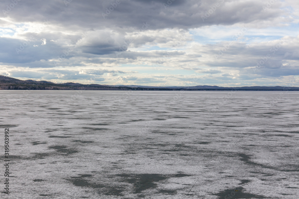 Spring nature. Melting ice on rivers and lakes. Sunny day in Siberia. selective focus Spring nature. Melting ice on rivers and lakes. Sunny day in Siberia. selective focus