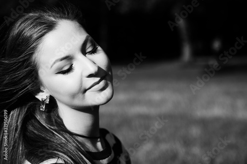 Outdoors portrait of a beautiful young woman smiling