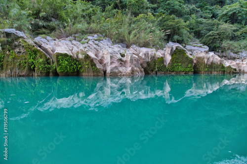 Amazing crystalline blue water of Tamul waterfall, Close up view of spectacular Tamul River,at Huasteca Potosina in San Luis Potosi, Mexico