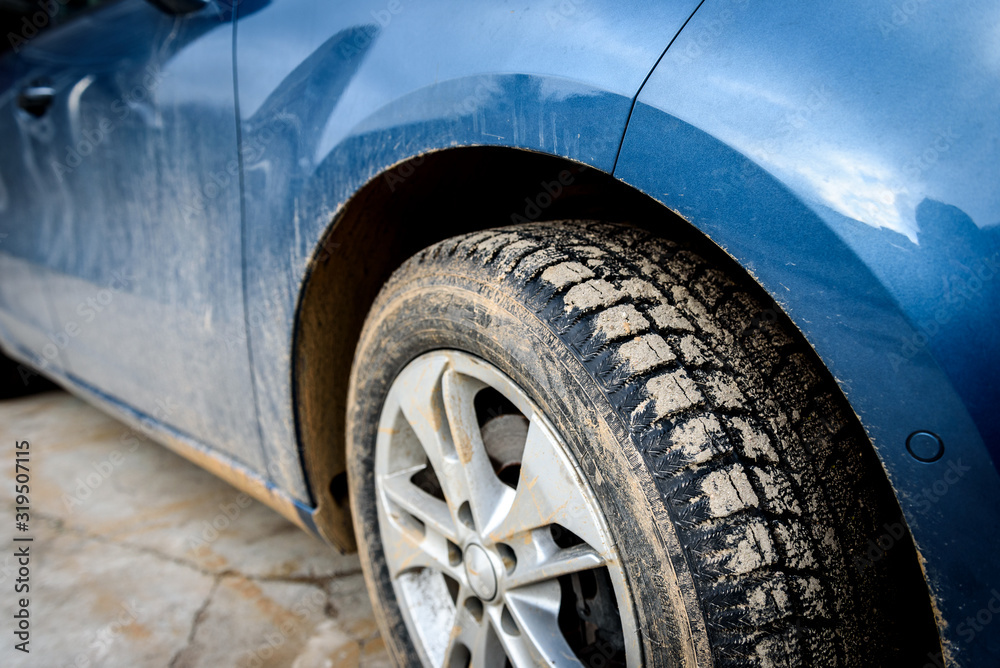 Dirty car wheel with swamp spray on the car. Dirty car wheel with swamp spray on the car.