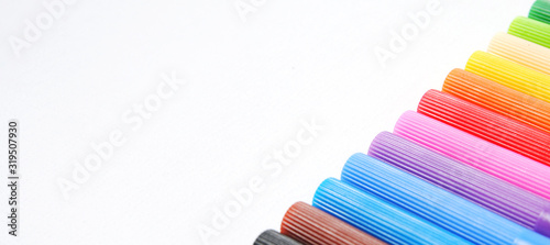 Color pen set isolated on white background close-up. Bright rainbow colored marker pens concept