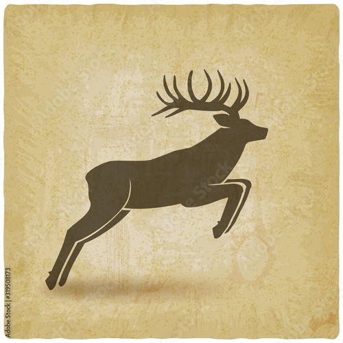 Jumping horned deer on vintage background