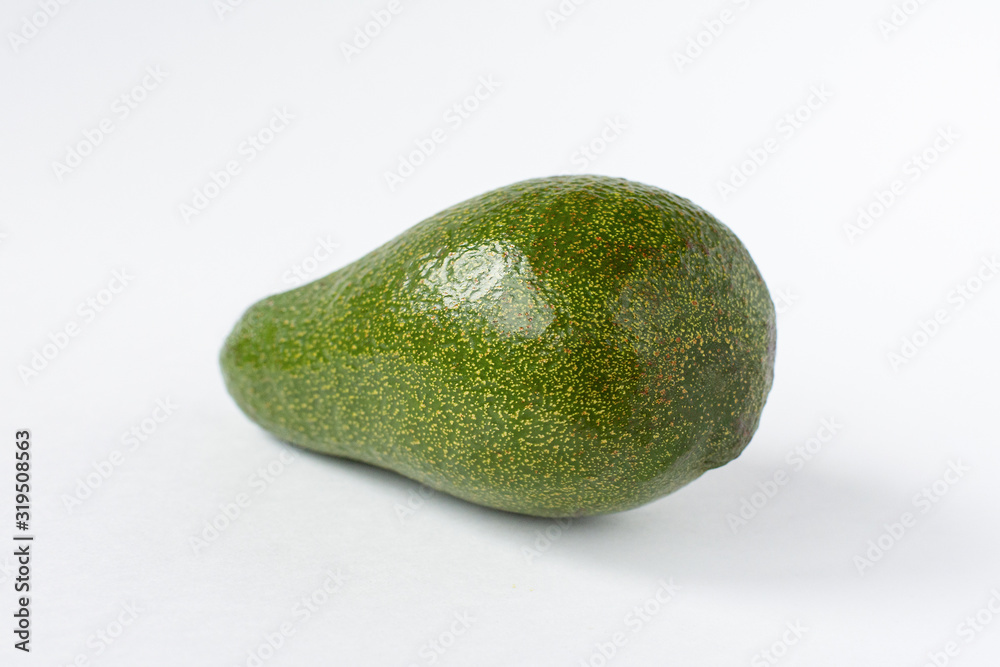 Green fresh avocado on a white background. Green fresh avocado on a white background.