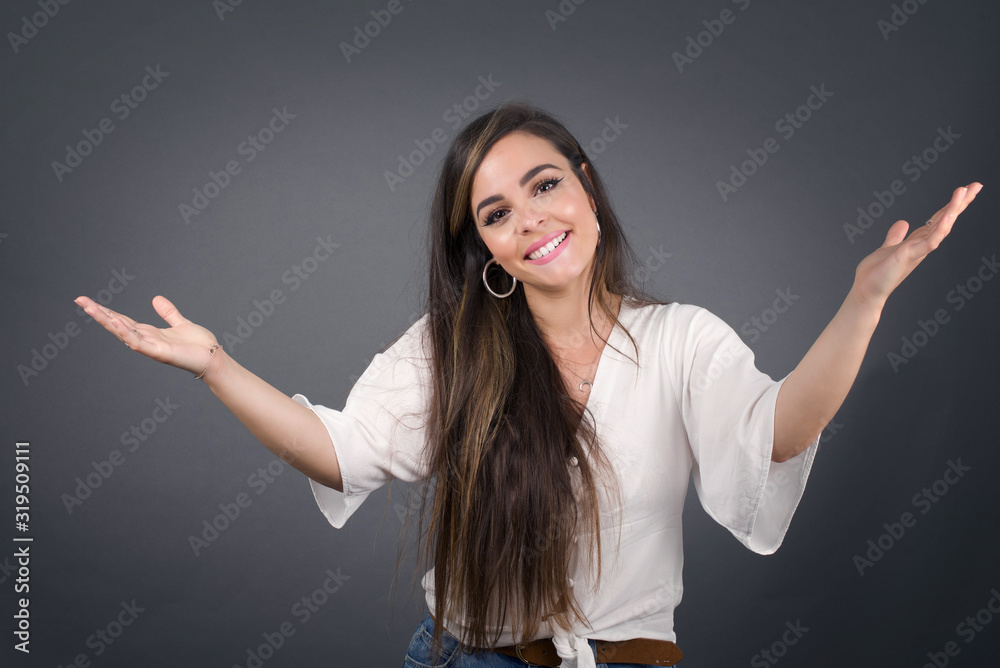Cheerful woman making a welcome gesture raising arms over head isolated on white background. Cheerful woman making a welcome gesture raising arms over head isolated on white background.