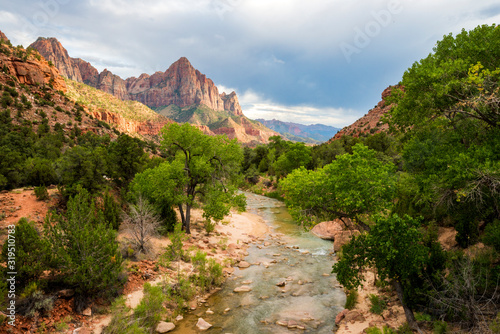 Beautiful soft light illuminates a stunning view of the Virgin River and The Watchman in Zion National Park, Utah.
