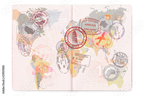 Opened passport with Visas, Stamps, Seals. World Map Travel or Tourism concept photo